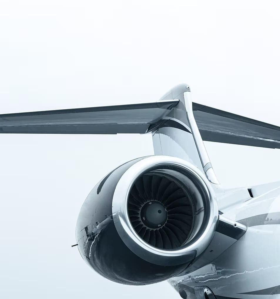 Close-up of the tail and engine of a jet aircraft.
