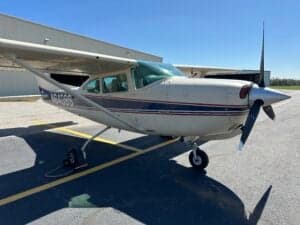 A close-up view of the Cessna 182 Skylane, registration N6408S, showing the nose and propeller.