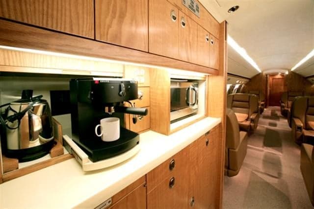 Interior view of the Gulfstream galley with coffee maker and microwave.