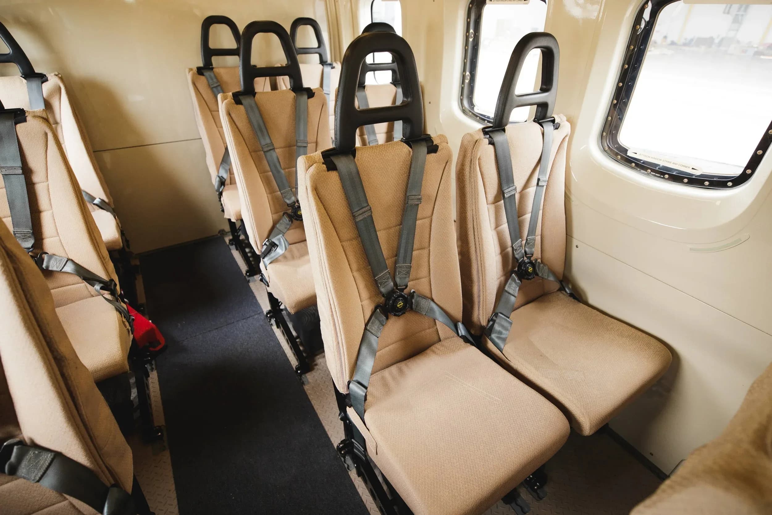 Close-up of the helicopter cabin seats with seatbelts.