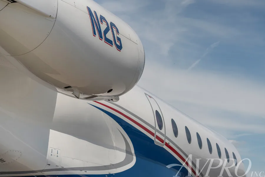 A close-up view of the engine nacelle with "N2G" registration and the fuselage of the Gulfstream G200.