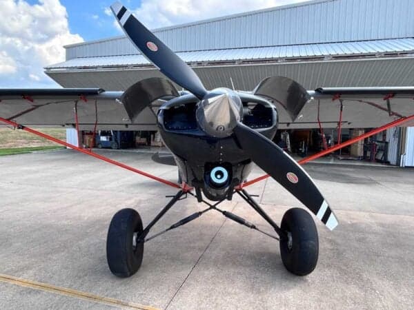 Front view of the American Legend aircraft with a black propeller.