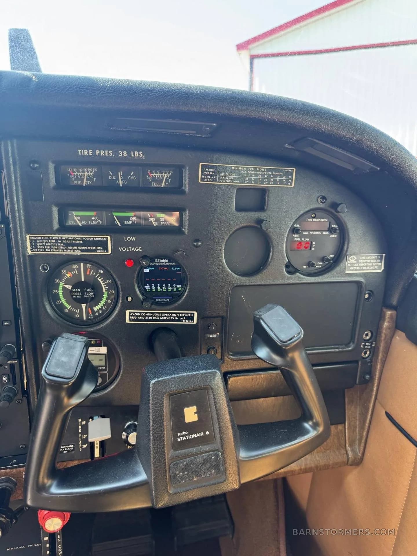 A close-up of the right side of the Cessna Stationair 6 instrument panel, showing the co-pilot's yoke and engine gauges.