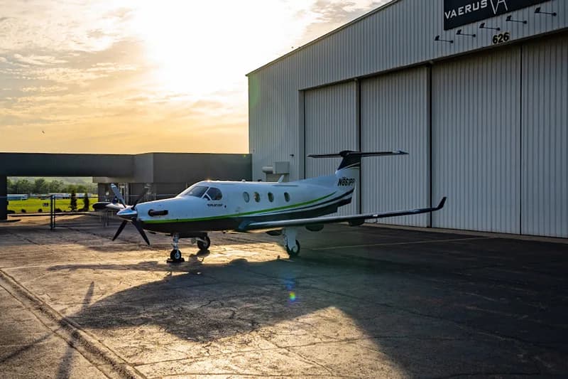Pilatus PC-12 aircraft N861PP parked in front of a hangar.