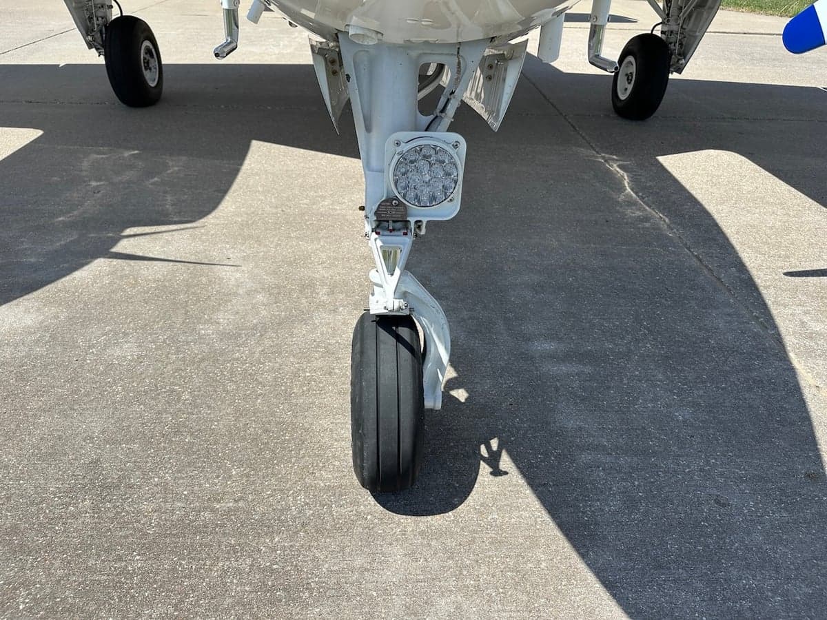 Close-up of the Beechcraft Baron's nose landing gear.