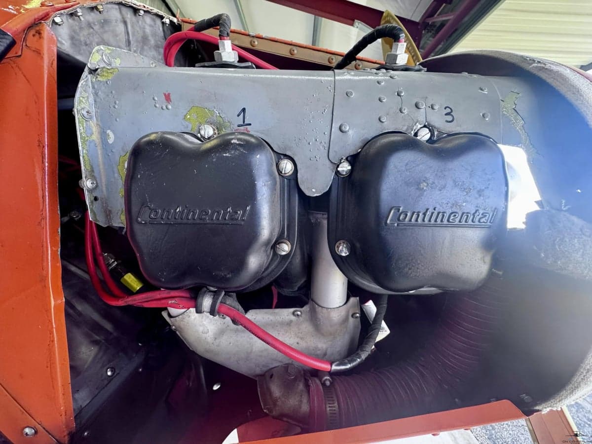 A close-up view of the Continental engine valve covers inside the aircraft's engine bay.