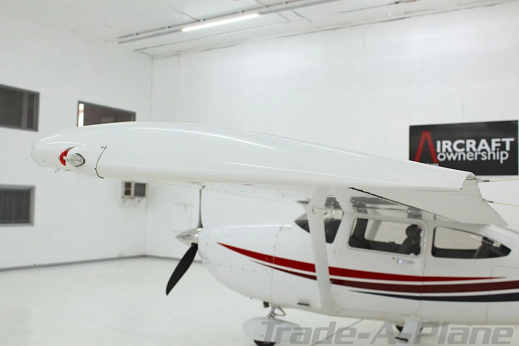 A front-left view of the Cessna Skylane N6768R, highlighting the wingtip and propeller.
