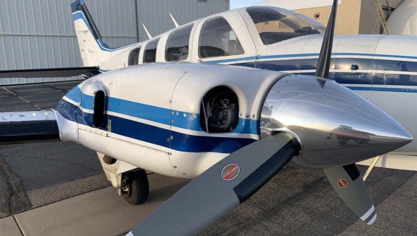 Close up of the propeller and engine of a Beechcraft Baron.