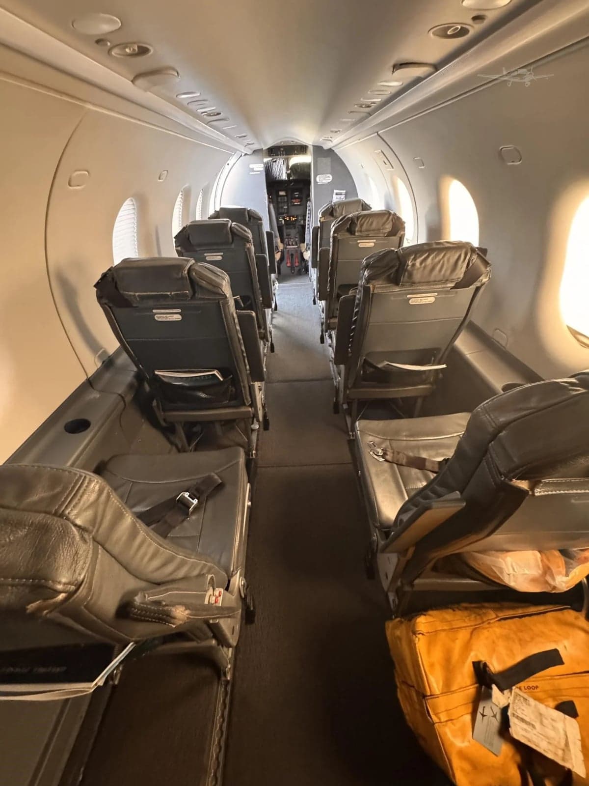 Interior view of the aircraft cabin, showing the seating arrangement and layout.