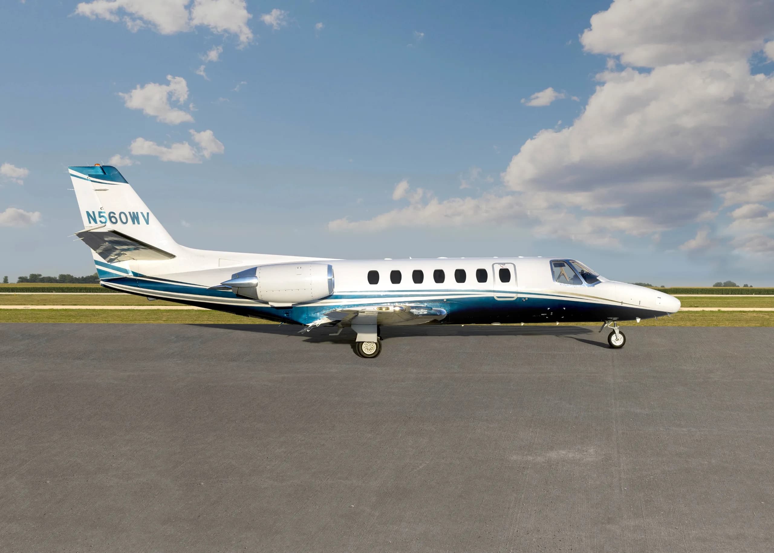 A Cessna Citation CJ1+ aircraft with registration N560WV on the tarmac, side view.