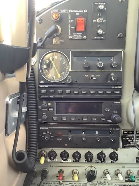Close-up of the aircraft's radio stack and switches.