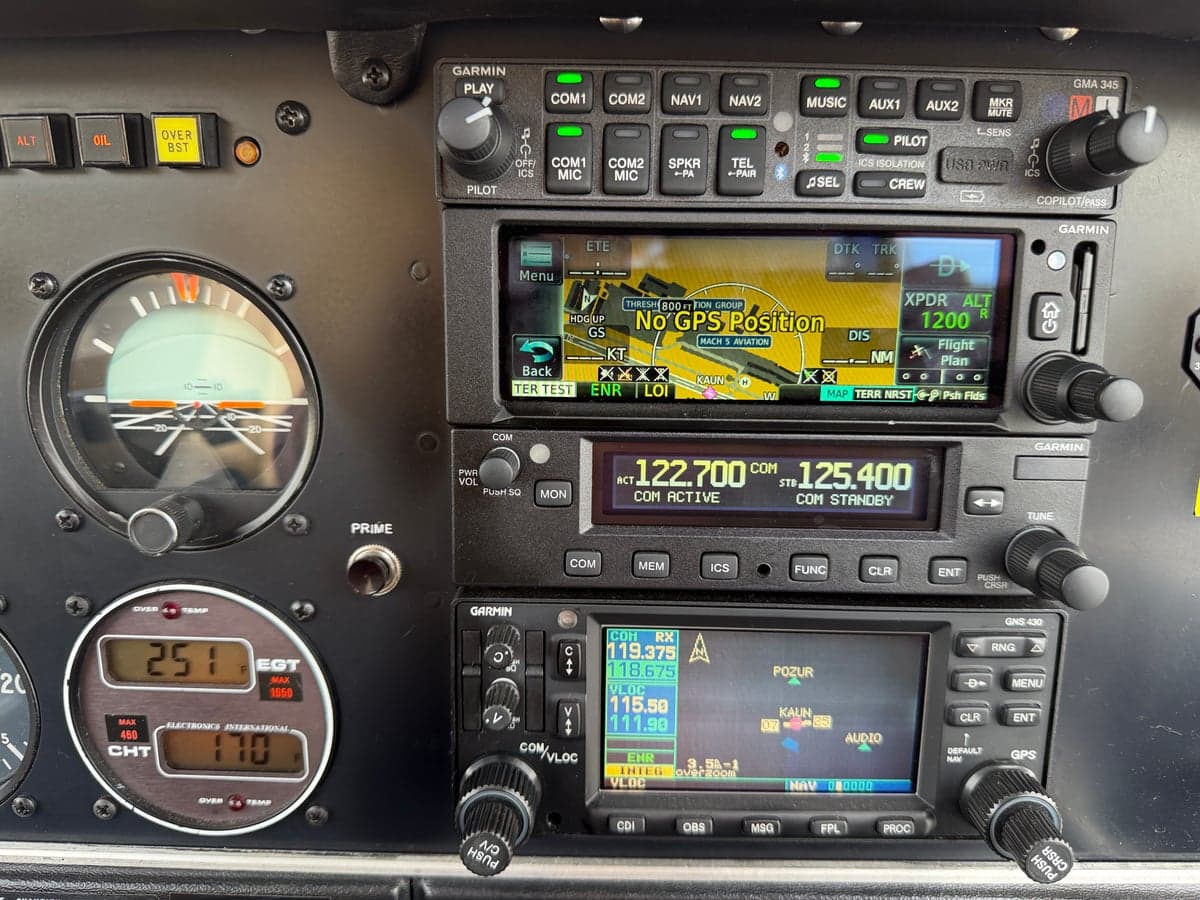 Close-up of the Garmin avionics stack and other instruments in the cockpit.