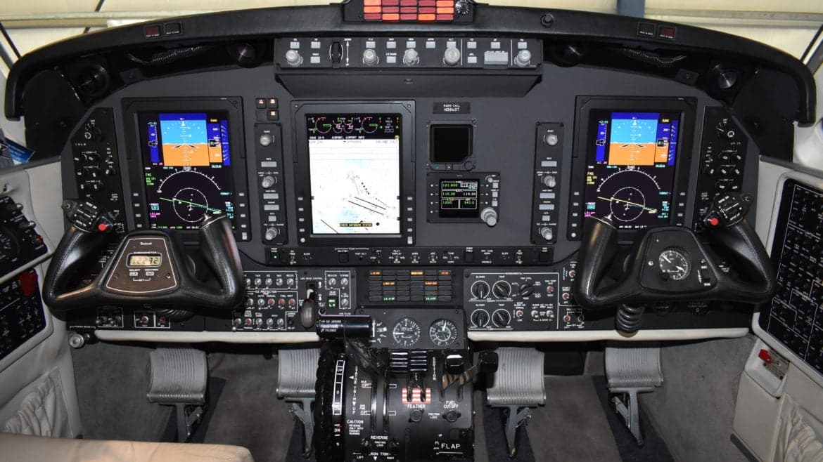 The cockpit of the King Air features a modern glass panel display.