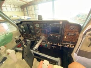 Close-up of the instrument panel inside the cockpit of the aircraft.