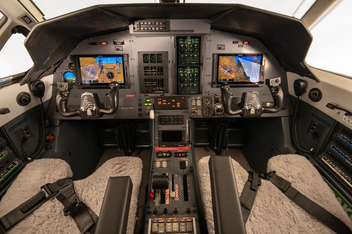 Detailed view of the aircraft cockpit with instrument panels and controls.