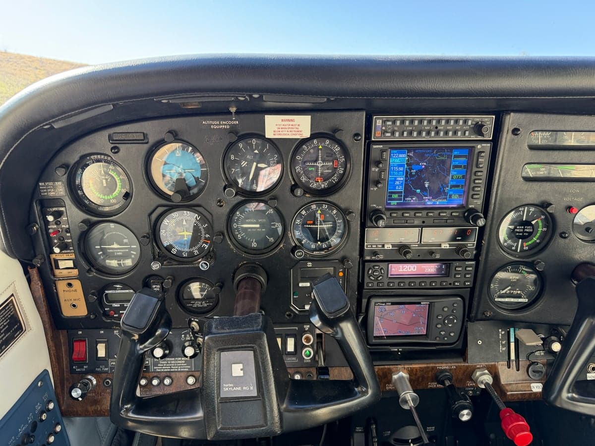 Close-up of the aircraft's instrument panel, showing various gauges and avionics.