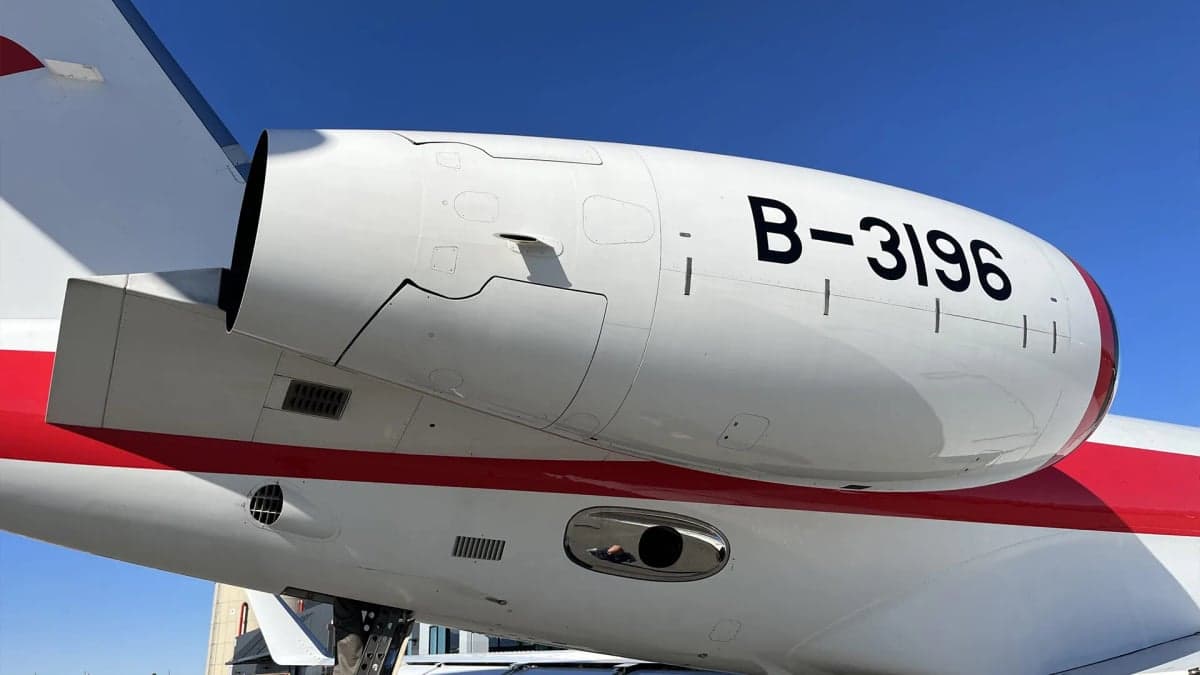 A close-up view of the rear engine and fuselage of a Gulfstream G650, showing the registration B-3196.