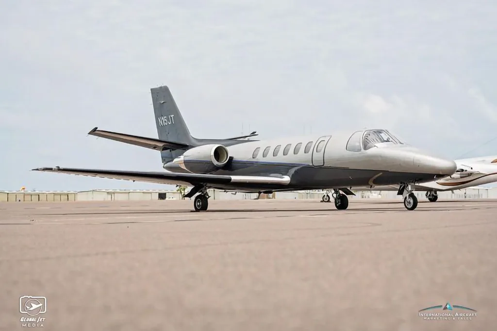 The N15JT Cessna Citation X business jet is shown from a low angle on an airfield.