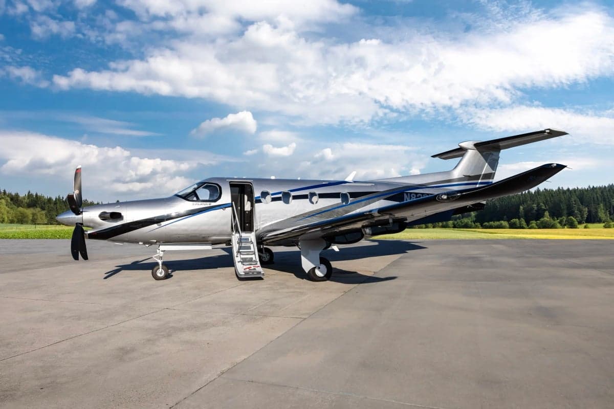 Pilatus PC-12NG with the door and stairs open on the tarmac.
