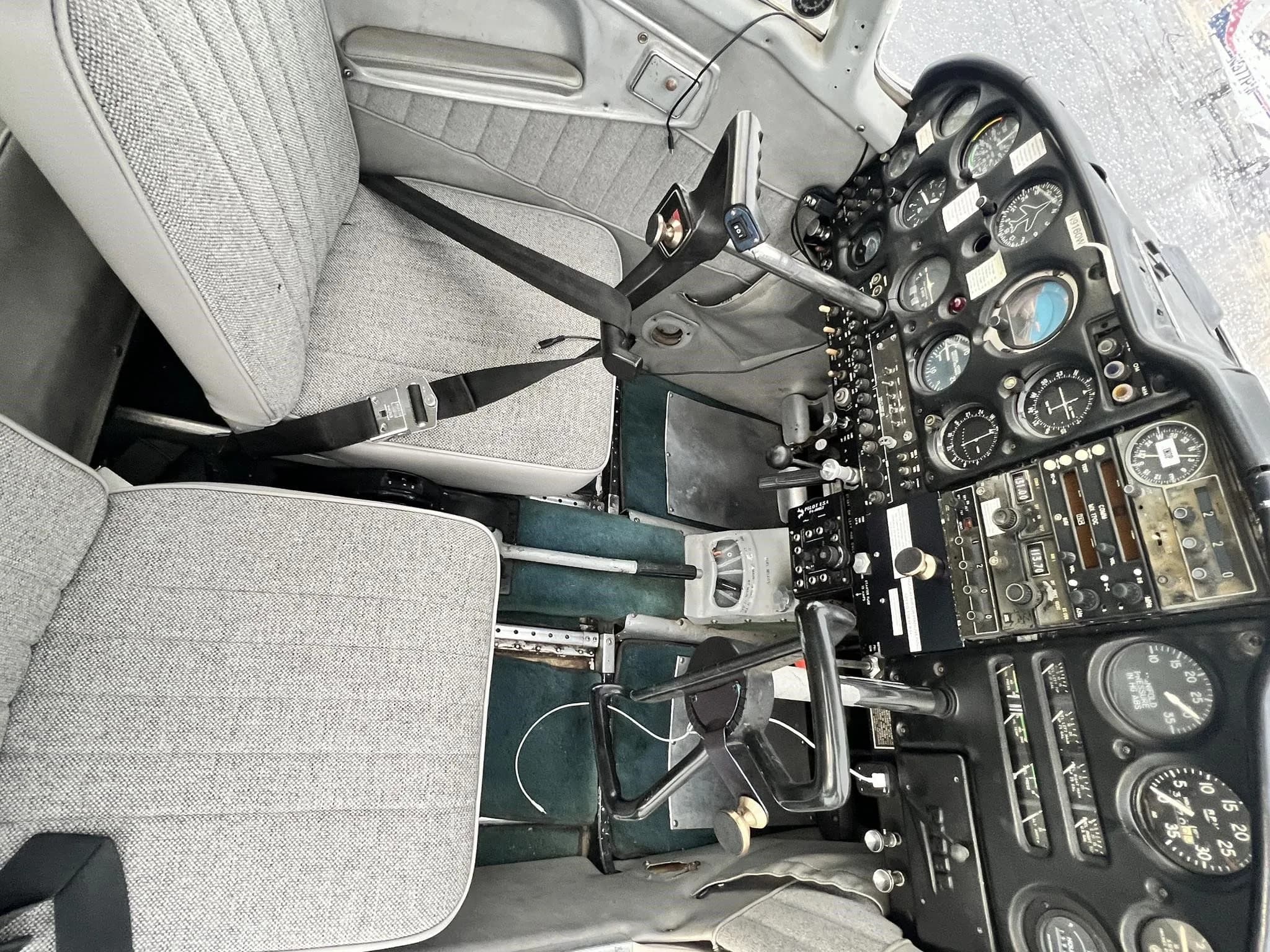 Interior view of the cockpit and front seats of the Piper Cherokee 235 B.