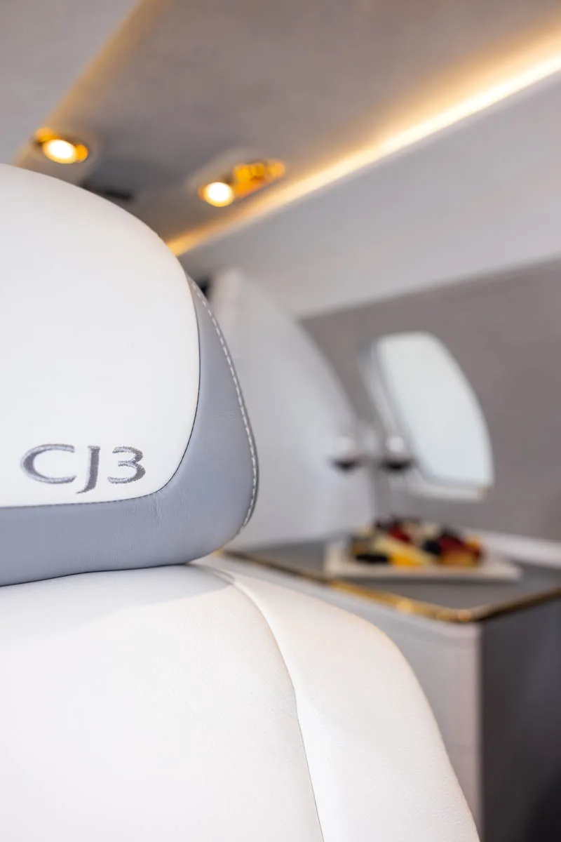 Close up of a CJ3 seat with a side table.