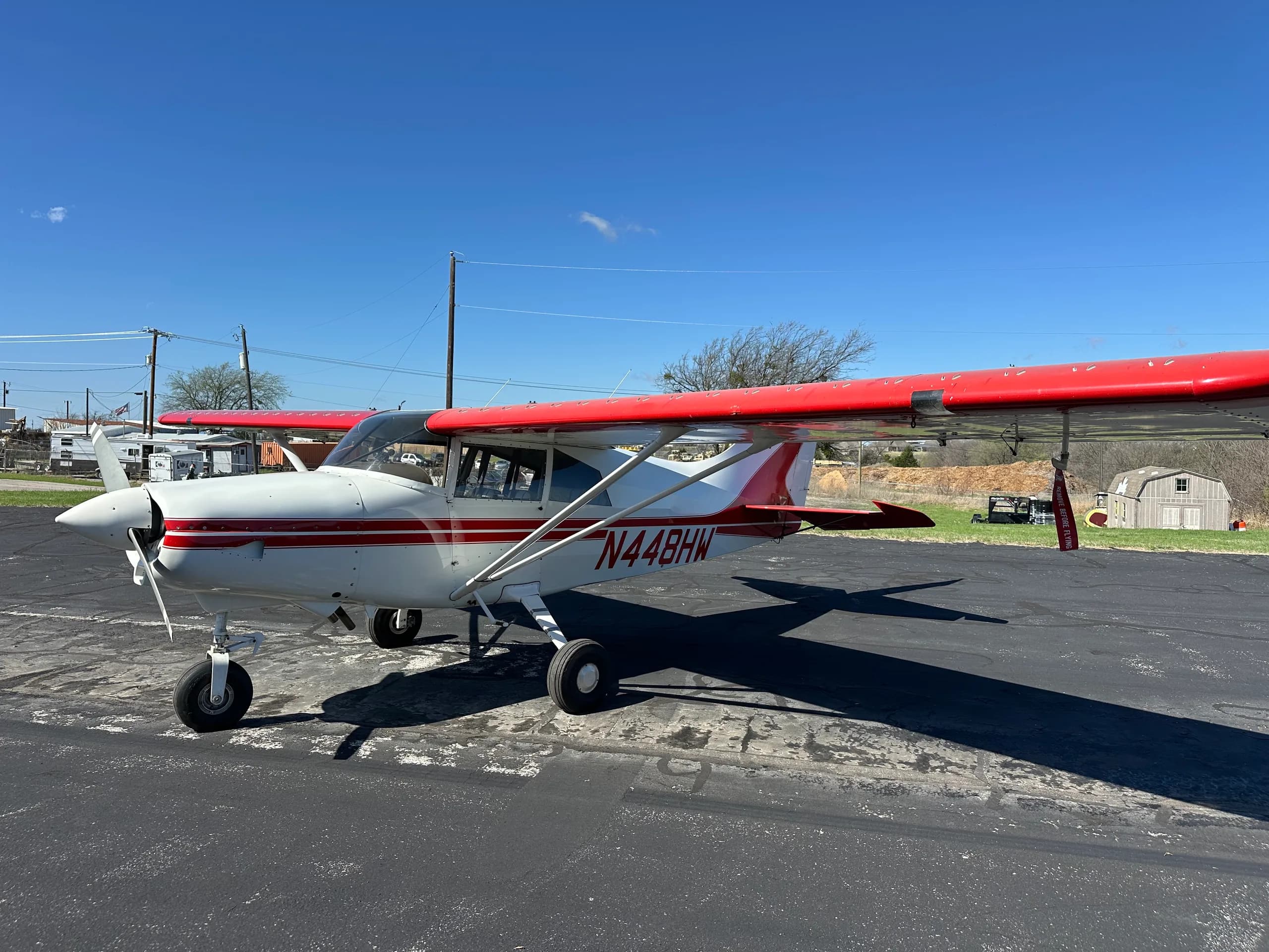 A Maute aircraft with red and white paint scheme is parked on the tarmac.