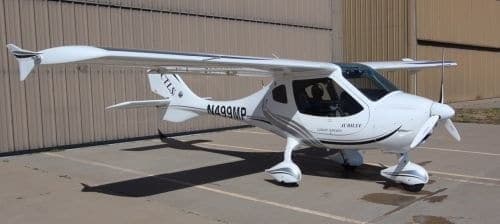 A white CTLS aircraft is parked on the tarmac.