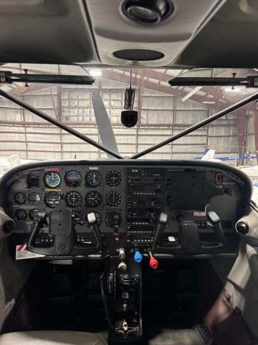 The instrument panel of the Cessna 206 is shown.