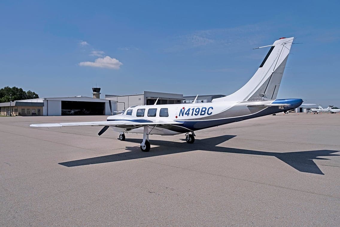 Rear quarter view of Aerostar aircraft N419BC parked on the tarmac.