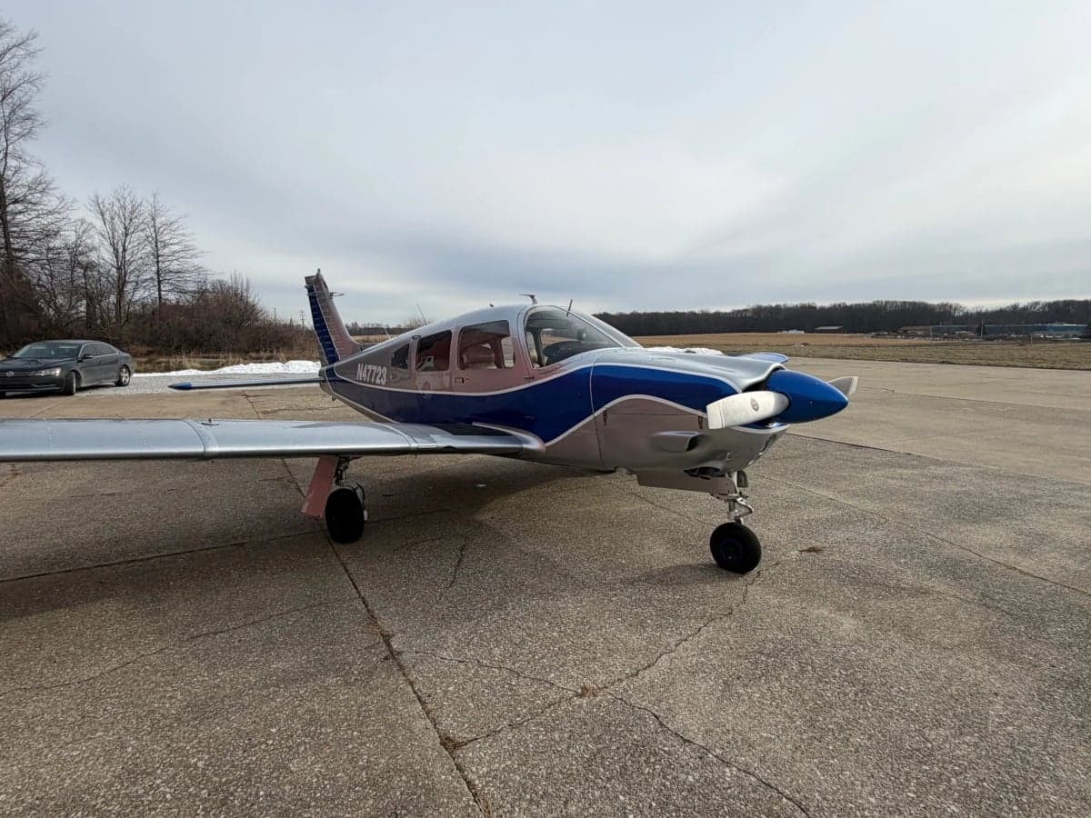A Piper PA-28-181 Archer II aircraft with registration N47723 parked on the tarmac.