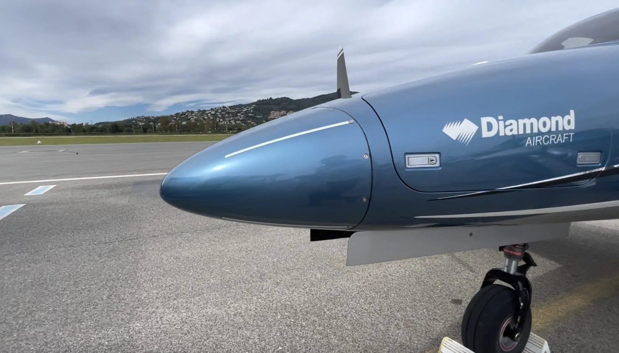 Close-up of the nose of a Diamond DA62 aircraft.