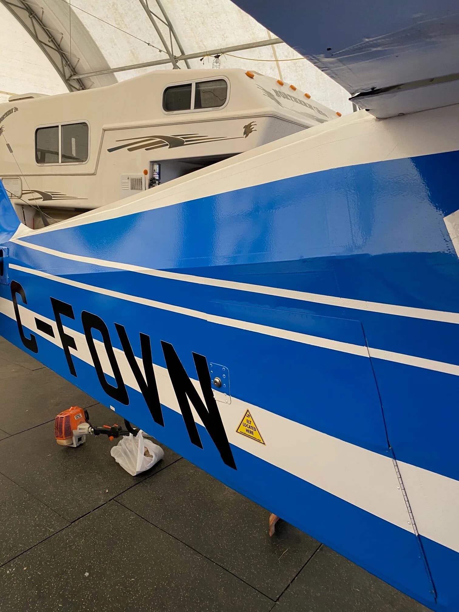 Close up of the tail section of the Piper Tri-Pacer with registration C-FOVN.