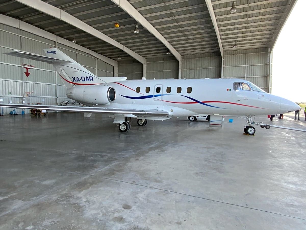 XA-DAR Falcon 50 parked in a hangar, side view.