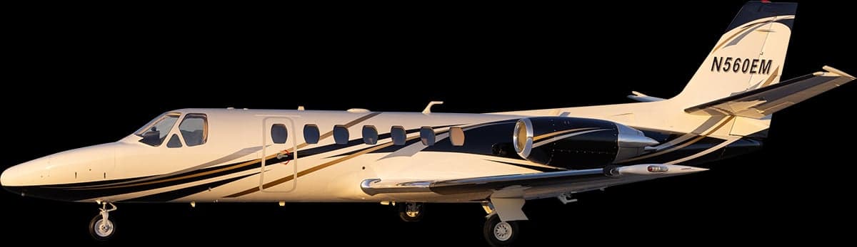 Side view of the N560EM aircraft with a black background.