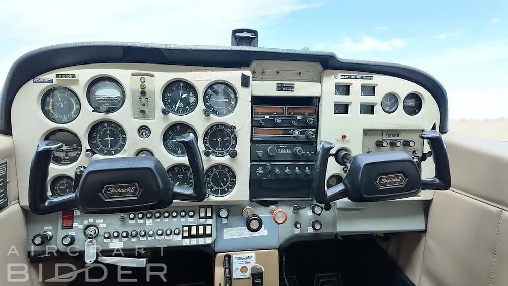 The instrument panel and 'Skyhawk II' yokes of a Cessna 172 aircraft.