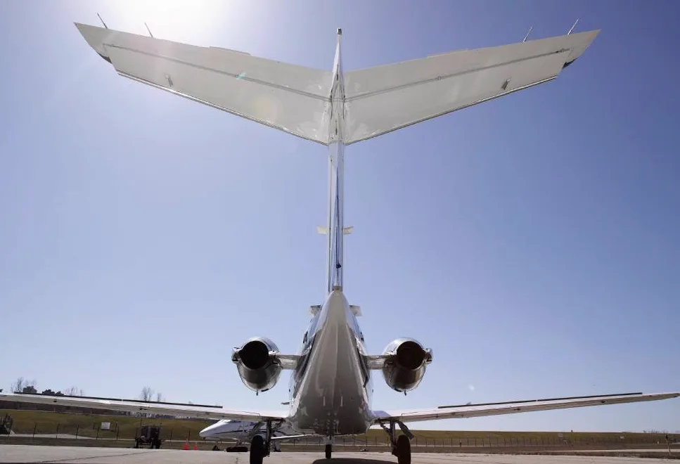 Rear view of a Hawker 400XP aircraft tail and engines.