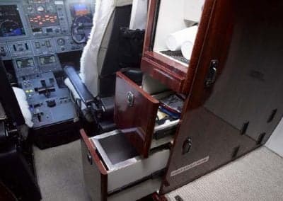 A storage cabinet is located near the cockpit of the Citation CJ3+.
