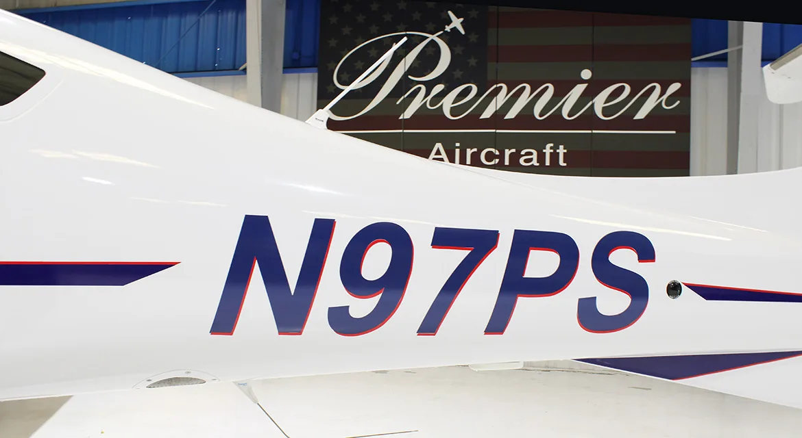 Close-up of the tail of a Diamond DA62 aircraft with registration N97PS.