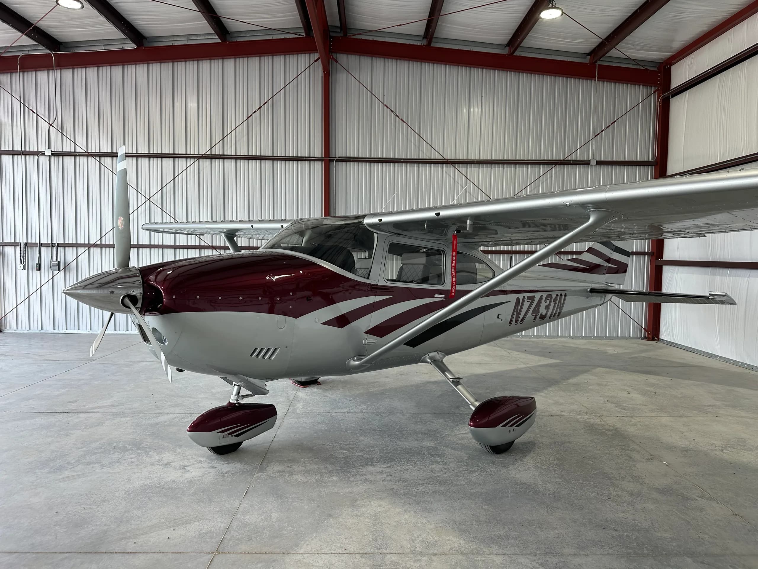 Cessna 182 Skylane N7431N parked inside a hangar.