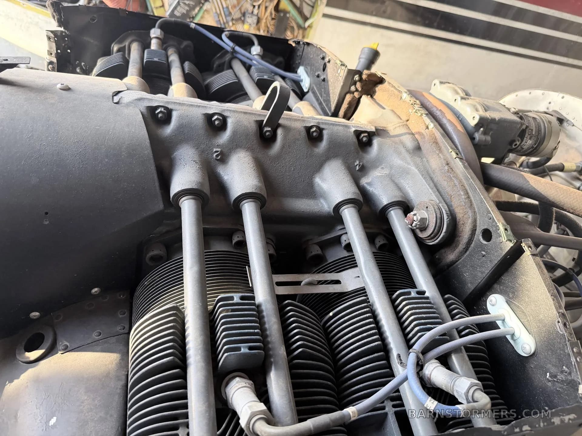 A close-up view of the cylinders and components of an aircraft engine.