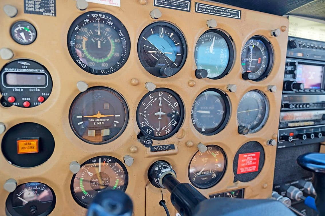 Detailed view of the Cessna 206 instrument panel gauges.