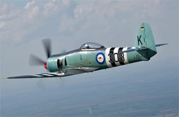 Hawker Sea Fury in flight over the ocean.