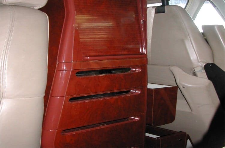 Interior view of the aircraft cabin with wood accents.