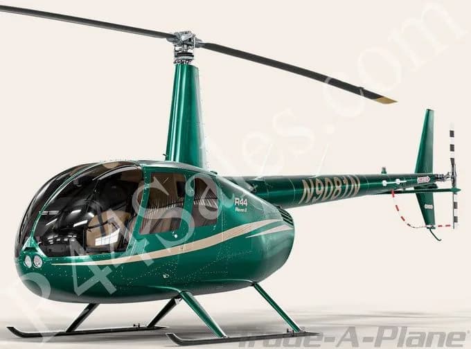 A green Robinson R44 Raven II helicopter with registration N9DBIN, featuring a light stripe, viewed from the front-right side.