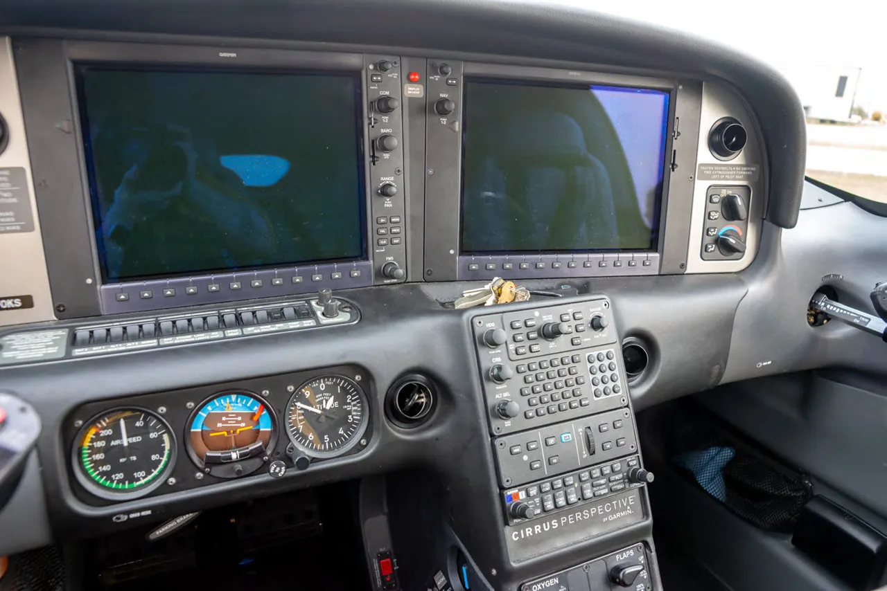 The instrument panel of a Cirrus aircraft, featuring Garmin Perspective avionics.