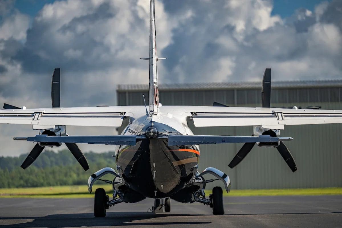 Rear view of the N33EW aircraft on the tarmac.