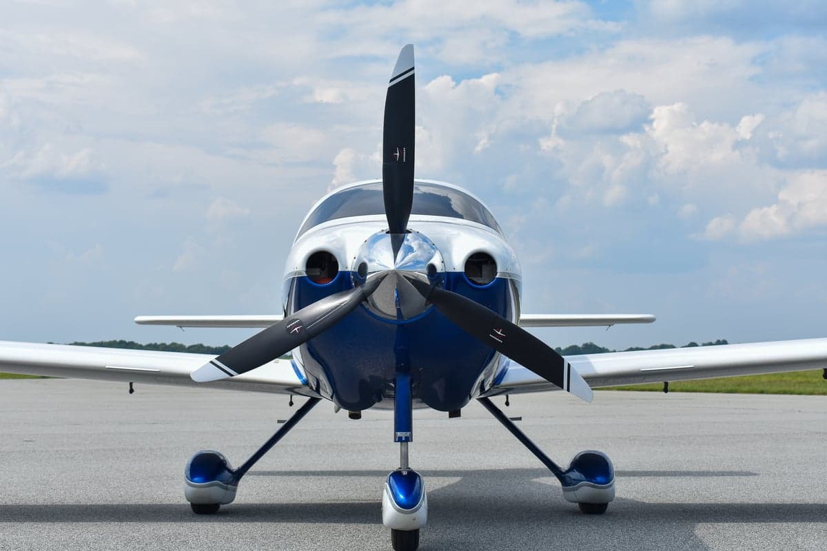 Front view of a Cirrus Columbia 350 with doors open.