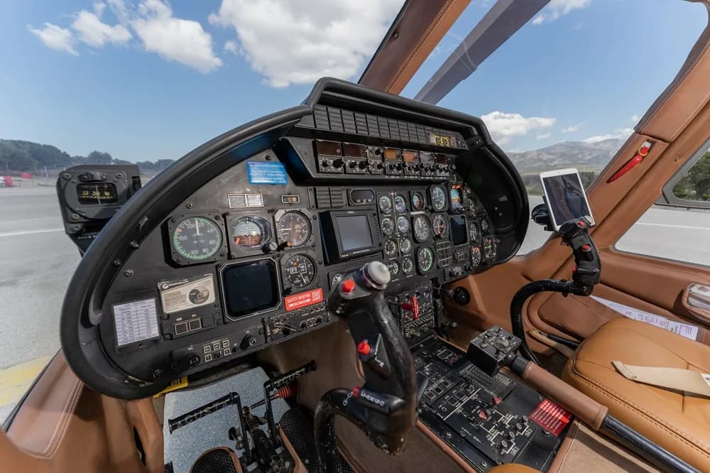 Close-up view of the helicopter cockpit instrument panel.