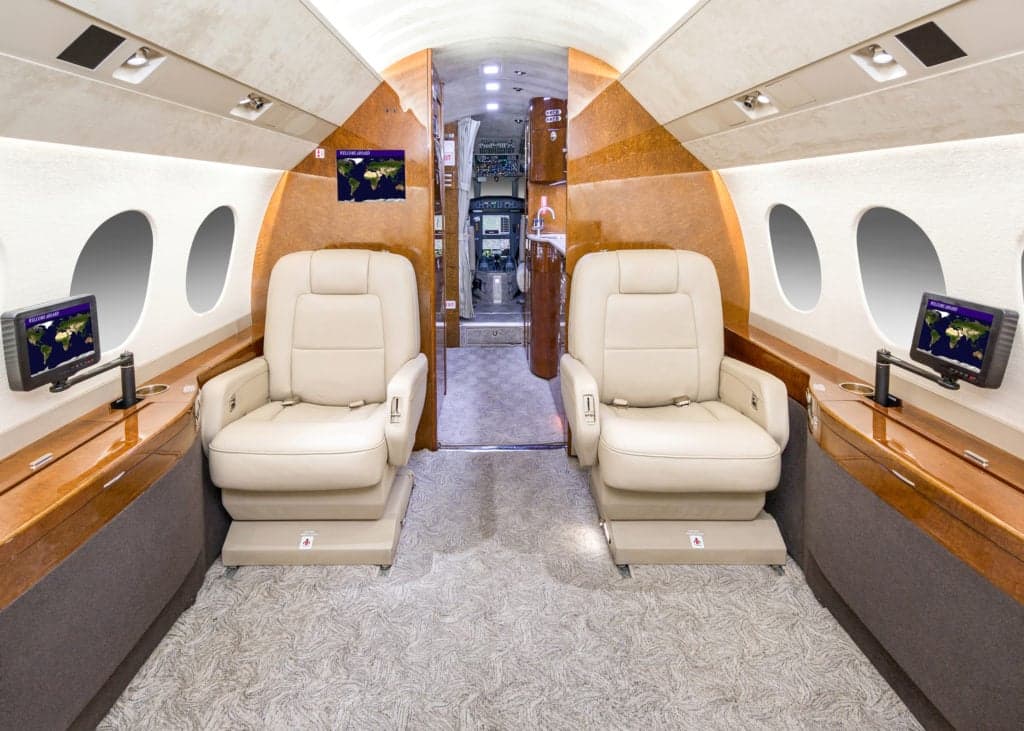 View of the aircraft cockpit with instrument panel and controls.