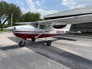 A Cessna Skylane N42974 parked outside a hangar on the tarmac.